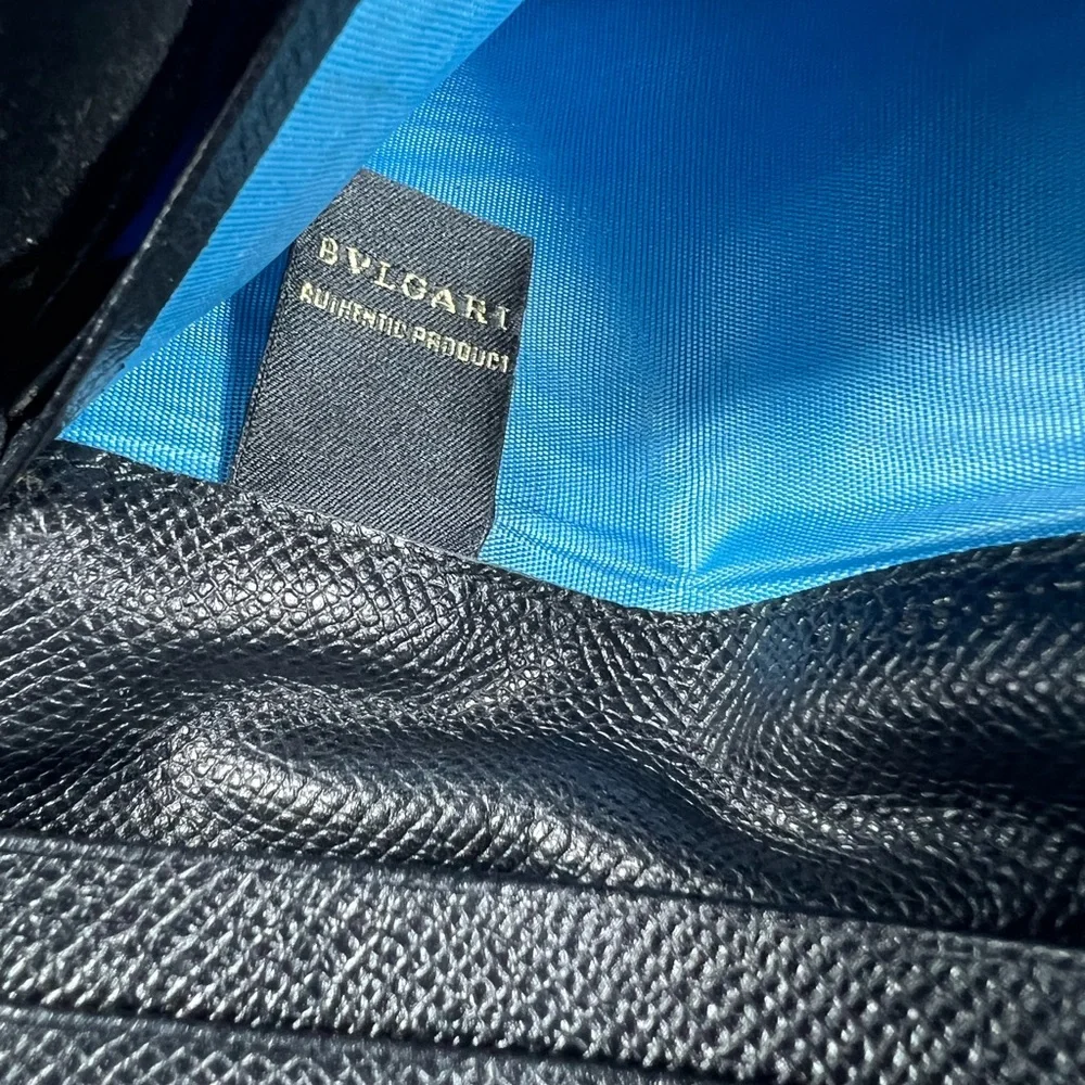 1050: Bvlgari Logo Ring Continental Wallet Black Grained Leather Blue